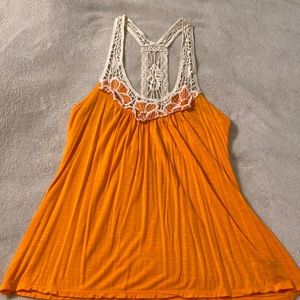Sleeveless top with decorative straps made of 100% Rayon by Rue 21 in medium.